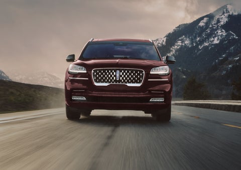 A 2024 Lincoln Aviator® SUV is shown in the Diamond Red exterior color. | Apple Lincoln Apple Valley in Apple Valley MN