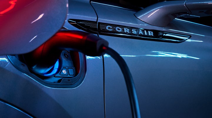 A charger plugged into the charging port of a 2024 Lincoln Corsair® Plug-in Hybrid model. | Apple Lincoln Apple Valley in Apple Valley MN