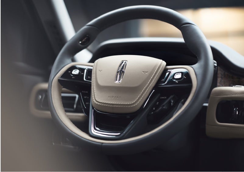 The intuitively placed controls of the steering wheel on a 2023 Lincoln Aviator® SUV | Apple Lincoln Apple Valley in Apple Valley MN