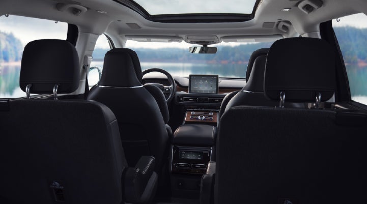 The interior of a 2024 Lincoln Aviator® SUV from behind the second row | Apple Lincoln Apple Valley in Apple Valley MN
