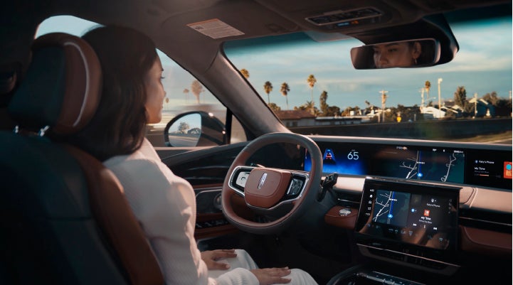 A person is shown driving hands-free on the highway with available Lincoln BlueCruise technology. | Apple Lincoln Apple Valley in Apple Valley MN