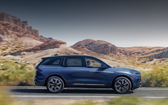 A 2024 Lincoln Nautilus® SUV is being driven in a desert setting. | Apple Lincoln Apple Valley in Apple Valley MN