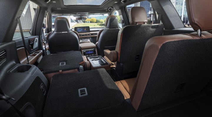 One side of the PowerFold® third-row seat and a second-row seat are folded forward in the 2026 Lincoln Aviator® SUV. | Apple Lincoln Apple Valley in Apple Valley MN