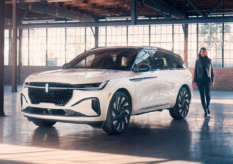 A person approaches a 2026 Lincoln Nautilus® SUV. | Apple Lincoln Apple Valley in Apple Valley MN