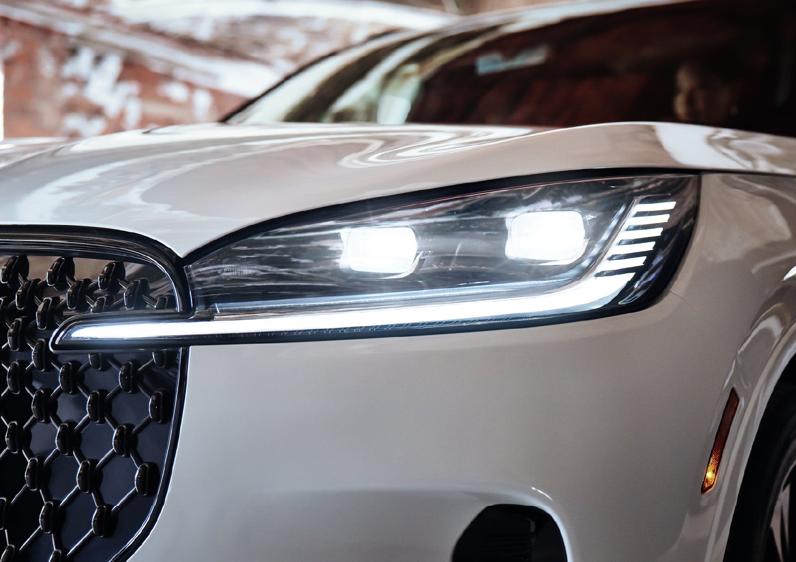 A close-up of a headlamp on the 2027 Lincoln Aviator® SUV is shown. | Apple Lincoln Apple Valley in Apple Valley MN