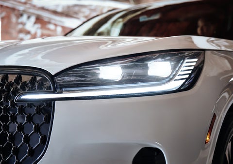 A close-up of a headlamp on the 2027 Lincoln Aviator® SUV is shown. | Apple Lincoln Apple Valley in Apple Valley MN